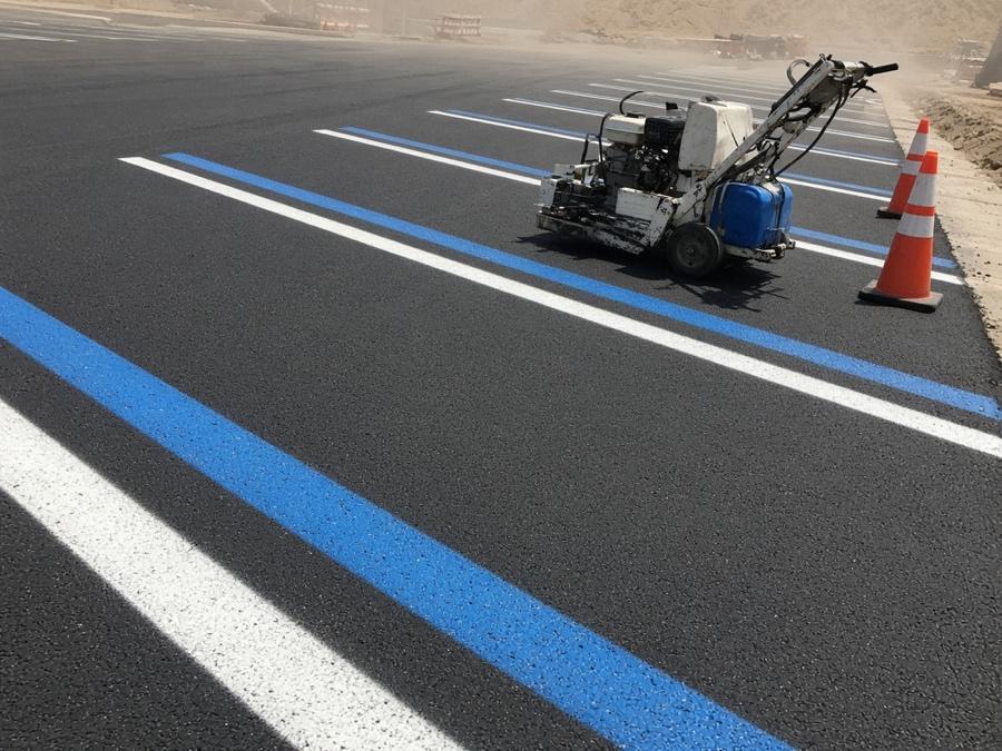 Fresh ADA stall striping on new asphalt — asphalt paving in Riverside, CA